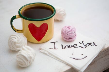 Cup Of Coffee. Coffee in cup with red heart and dessert. Handwriting I love you. Creative concept.の写真素材