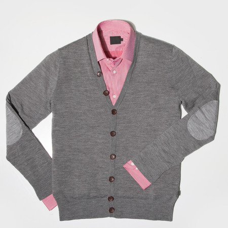 Colorful placed trendy clothes. Cardigan and shirt on a white backgroundの写真素材