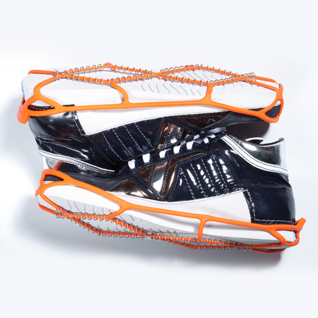 Shoe spikes imposed on shoes, to increased safety for snow and iceの写真素材