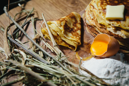 Russian traditional pancakes - blini. On wooden tableの写真素材