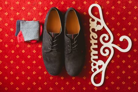 The groom&amp;amp;#39;s shoes and socks on the carpetの写真素材