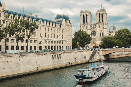 Paris, Notre Dame  with boat on Seine, Franceのeditorial素材