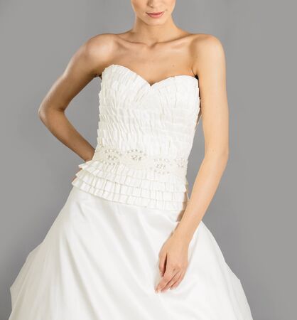 Beautiful bride on grey background. Studio shotの写真素材