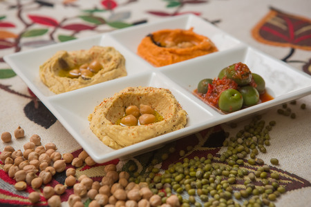 Delicious and healthy hummus set in white pate.の写真素材