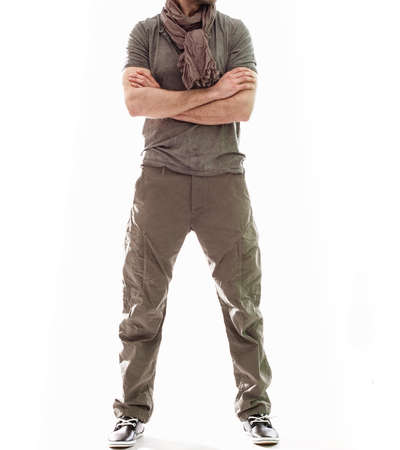 Elegant young handsome man in gray clothing. Studio fashion portrait.の写真素材