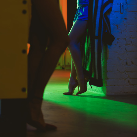 Perfect females legs wearing high heels in interiorの写真素材