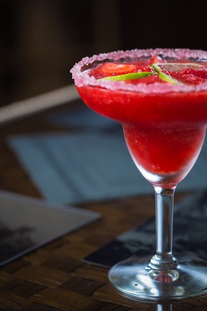 Strawberry margarita cocktail on the bar. Shallow dofの写真素材