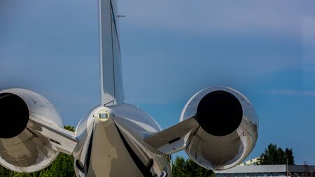 Airplane at the terminal gate preparing the takeoff. Concept of alternative lifestyle and permanent traveling around the worldの写真素材