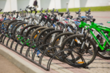 Group of bikes in parking in summer park. Blur backgroundの写真素材