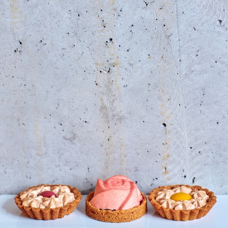 Sweet tartlets filled with cream. の写真素材