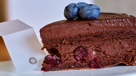 Piece of chocolate cake on concrete backgroundの写真素材