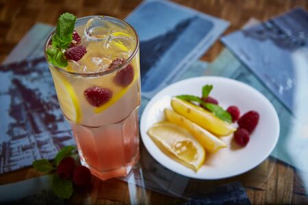 Refreshing homemade lemonade with raspberries and french mintの写真素材