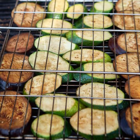 vegetables on the grill over low heat for preparingの写真素材