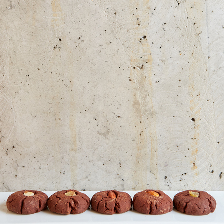 Chocolate cookies with nuts on gray backgroundの写真素材