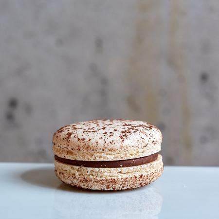 Sweet handmade macaroon on grey background. Shallow dofの写真素材