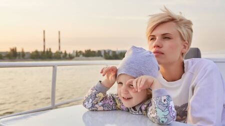 Mother, daughter on yacht or catamaran boat.  Concept of the familyの写真素材