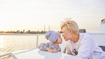 Mother, daughter on yacht or catamaran boat.  Concept of the familyの写真素材