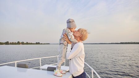Mother, daughter on yacht or catamaran boat.  Concept of the familyの写真素材