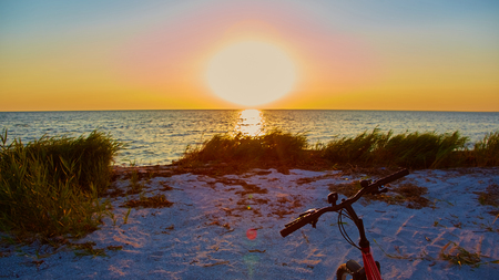 Bicycle at the beach on twilight timeの写真素材
