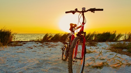 Bicycle at the beach on twilight timeの写真素材
