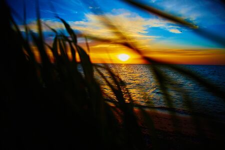 Sunset over the ocean. sunset at coast of the seaの写真素材