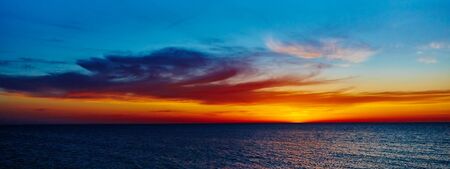 Sunset over the ocean. sunset at coast of the seaの写真素材