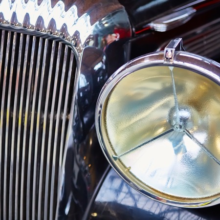 Detail of classic car. Close-up of headlightの写真素材