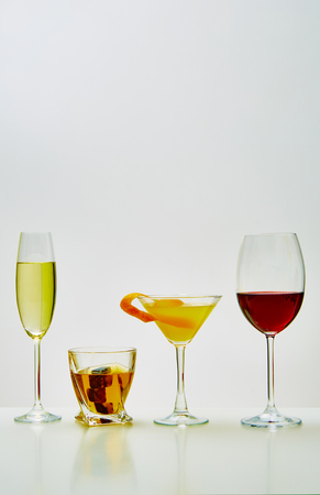 set with different drinks on white background - champagne, whiskey, cocktail, wineの写真素材