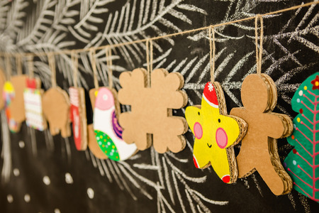 Cardboard toys for the Christmas tree or Christmas garland. Christmas decorations. Selective Focusの写真素材