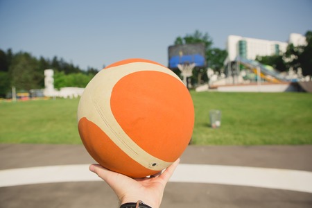 The basketball player about to shoot at summer dayの写真素材
