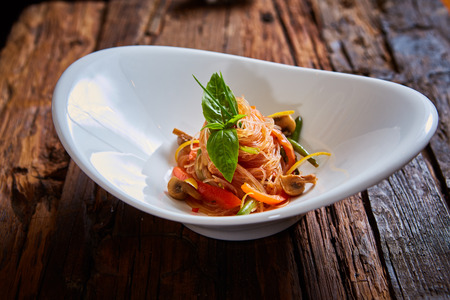 Glass noodles with mushrooms and vegetables. Dish of Korean cuisineの写真素材