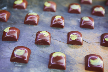 Small chocolate candy. A delicious mix of colorful chocolates.