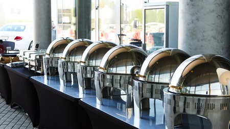The buffet Table with Row of Food Service Steam Pansの写真素材