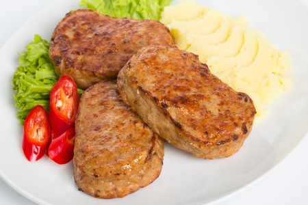 Homemade meat cutlets, delicious baked pork cutlets in crispy breadingの写真素材