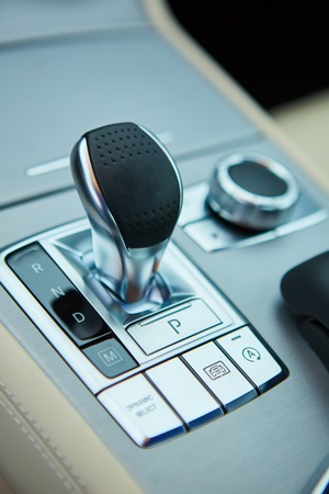 Detail of modern car interior, gear stick, automatic transmission in expensive carの写真素材