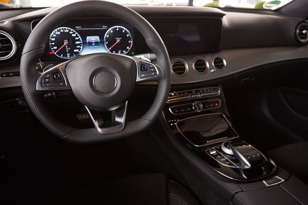 Luxury car Interior. Steering wheel and dashboardの写真素材