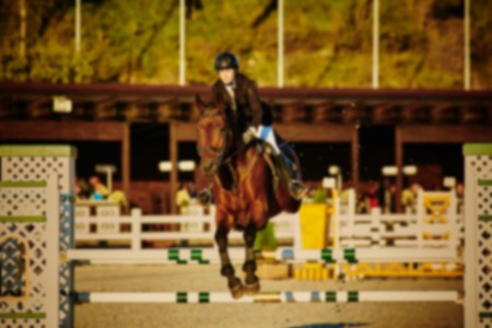 Equestrian Sports, Horse Jumping, Show Jumping themed photo blurred on purposeの写真素材