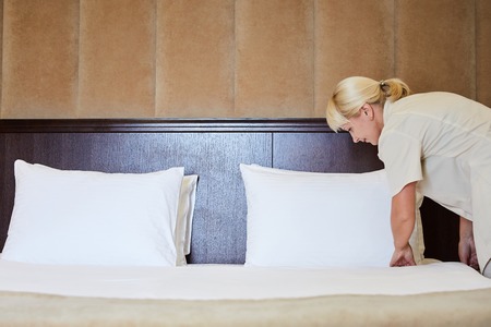 Hotel service. Made making bed in room.の写真素材