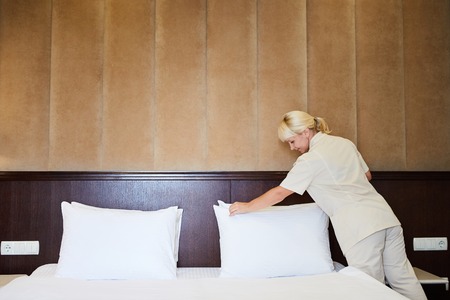 Hotel service. Made making bed in room.の写真素材