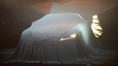 Close up of a new car hidden under cover.の写真素材
