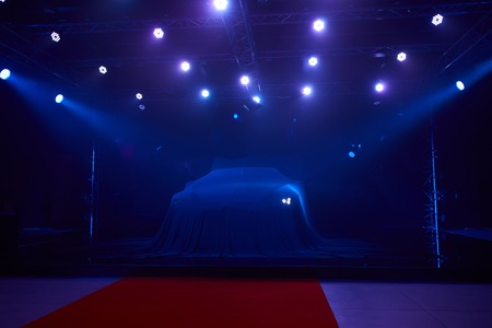 Close up of a new car hidden under cover.の写真素材