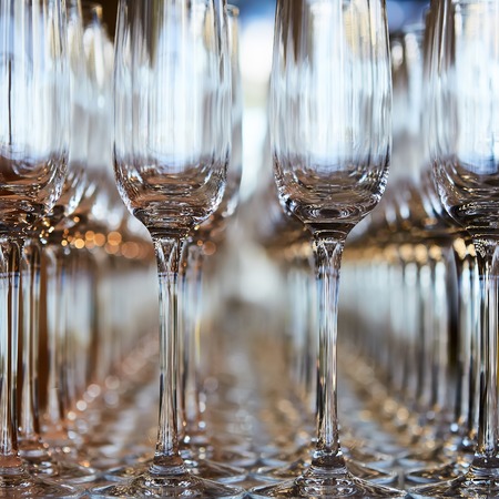 Rows of Empty Wine Glasses on the tableの写真素材