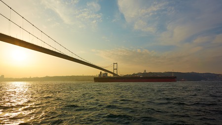 Turkey, Istanbul, Bosphorus Channel, Bosphorus Bridge, an cargo ship under the Bridge.の写真素材