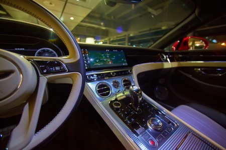 Car interior luxury. Interior of prestige modern car. Dashboard and steering wheel. Focus on...