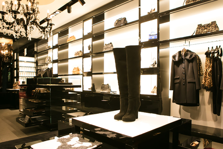 bright and fashionable interior of shoe store in modern mallの写真素材