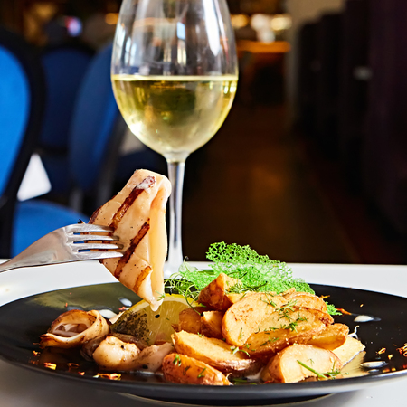 The grilled squid with salad. Shallow dof.の写真素材