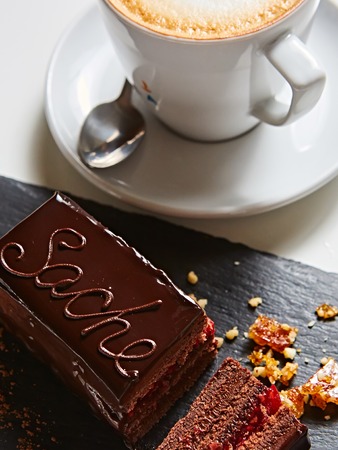 A piece of Sacher cake. Shallow dof.の写真素材