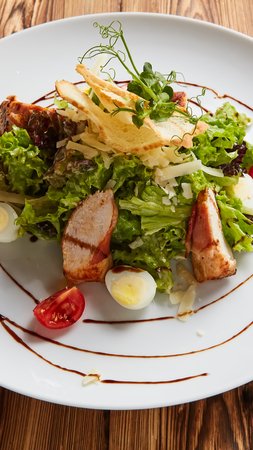 Chicken Salad. Chicken Caesar Salad. Caesar Salad with grilled chicken on plate.の写真素材