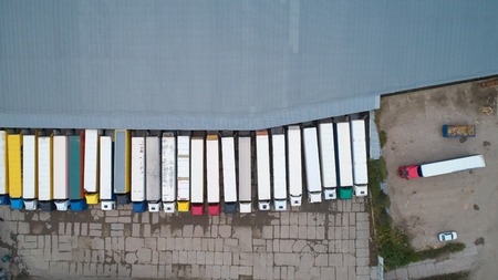 Aerial view of goods warehouse. Logistics center in industrial city zone from above.の写真素材