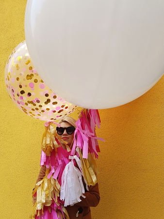 Young fashion happy blonde woman with baloons ,fashion photoの写真素材
